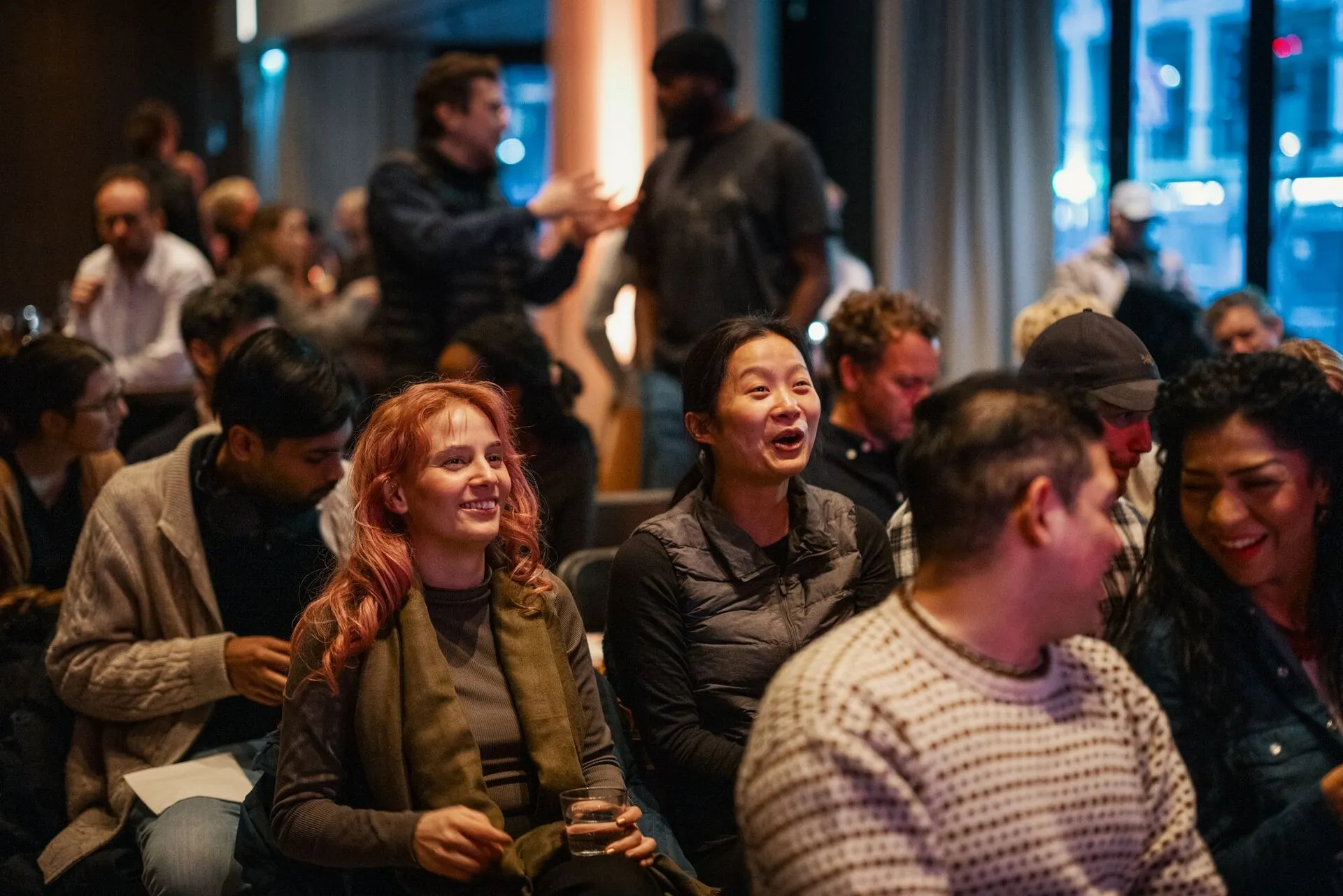 The audience at a Vibelabs event, mid-laugh